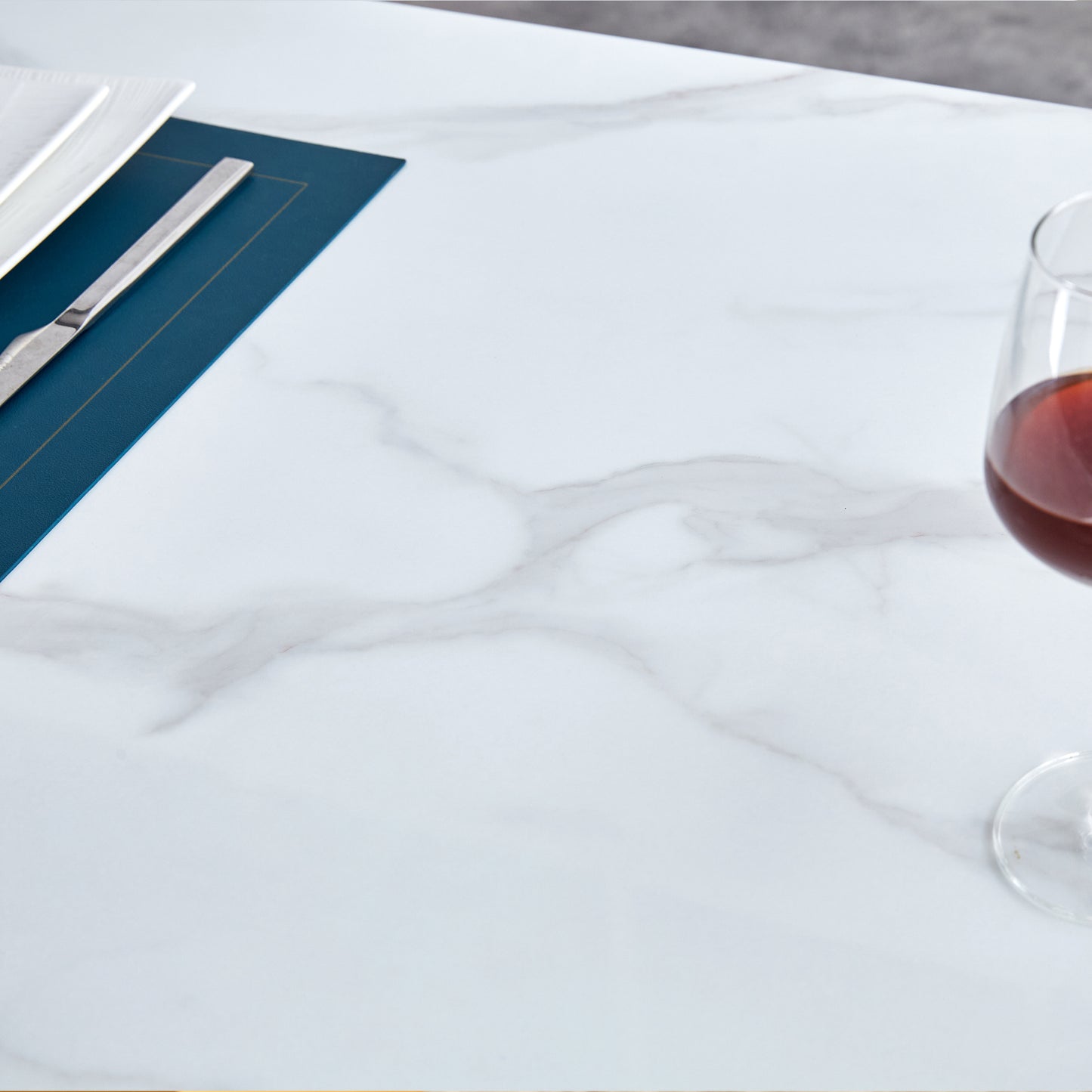 Table and chair set.Large modern rectangular table with 0.4 inch patterned glass tabletop and large MDF table legs.Comes with 6 chairs with faux leather cushioned seats and golden metal legs.