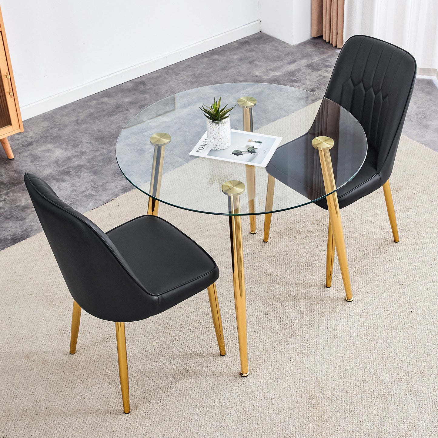 Table and chair set.36 Inch Diameter Modern Luxury Glass Dining Table and Chair Set - Gold Frame, Metal Legs.Two Black PU Chairs with Simple Line Designs On The Backrest.