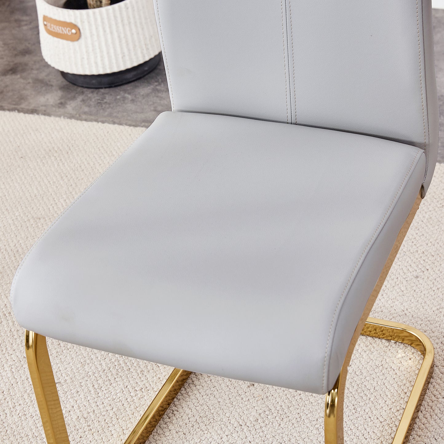 Table and chair set.Subtle Luxury Clear Tempered Glass Dining Set - 71"x35.4" with 6 Light Gray PU Chairs.C-tube Gold Metal Chair Legs.Bring a comfortable home experience to the kitchen, bedroom.