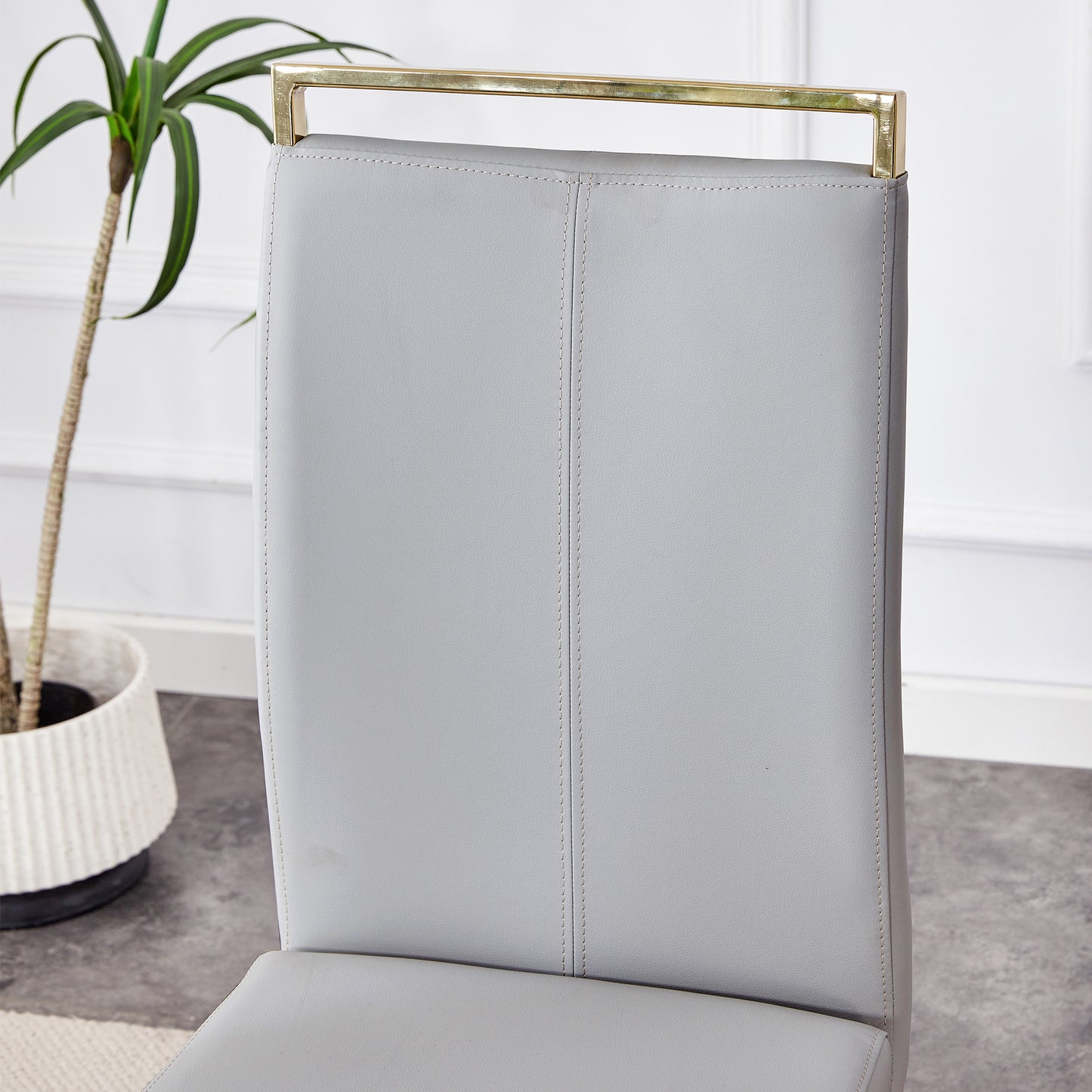 Table and chair set.Subtle Luxury Clear Tempered Glass Dining Set - 71"x35.4" with 6 Light Gray PU Chairs.C-tube Gold Metal Chair Legs.Bring a comfortable home experience to the kitchen, bedroom.