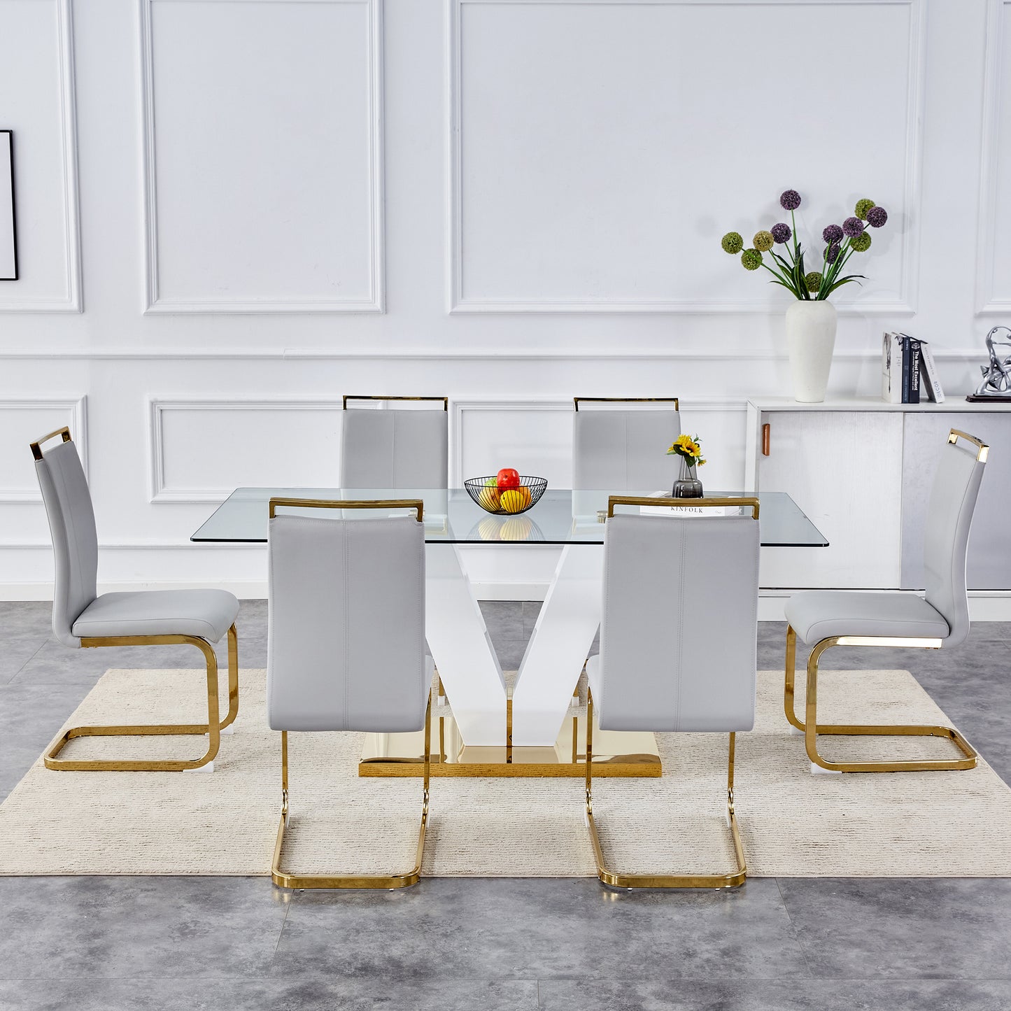 Table and chair set.Subtle Luxury Clear Tempered Glass Dining Set - 71"x35.4" with 6 Light Gray PU Chairs.C-tube Gold Metal Chair Legs.Bring a comfortable home experience to the kitchen, bedroom.
