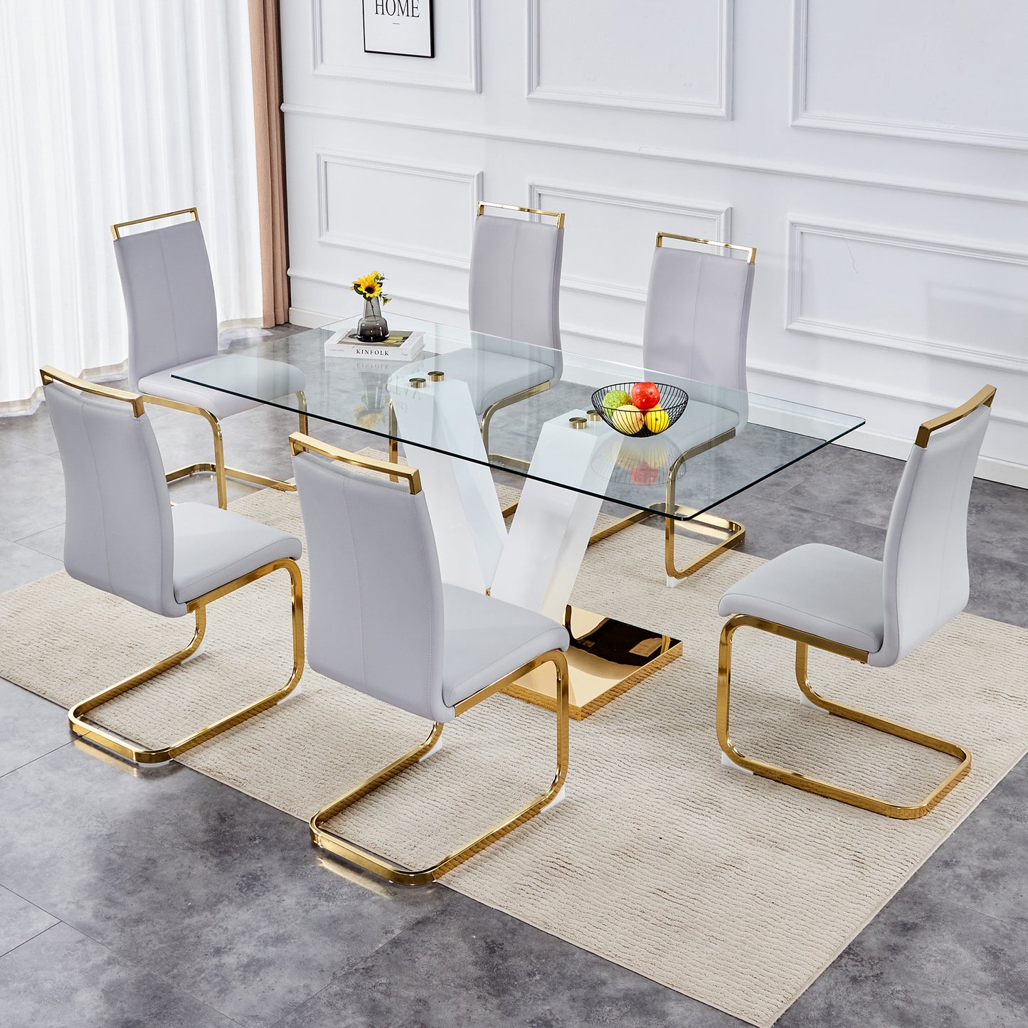 Table and chair set.Subtle Luxury Clear Tempered Glass Dining Set - 71"x35.4" with 6 Light Gray PU Chairs.C-tube Gold Metal Chair Legs.Bring a comfortable home experience to the kitchen, bedroom.