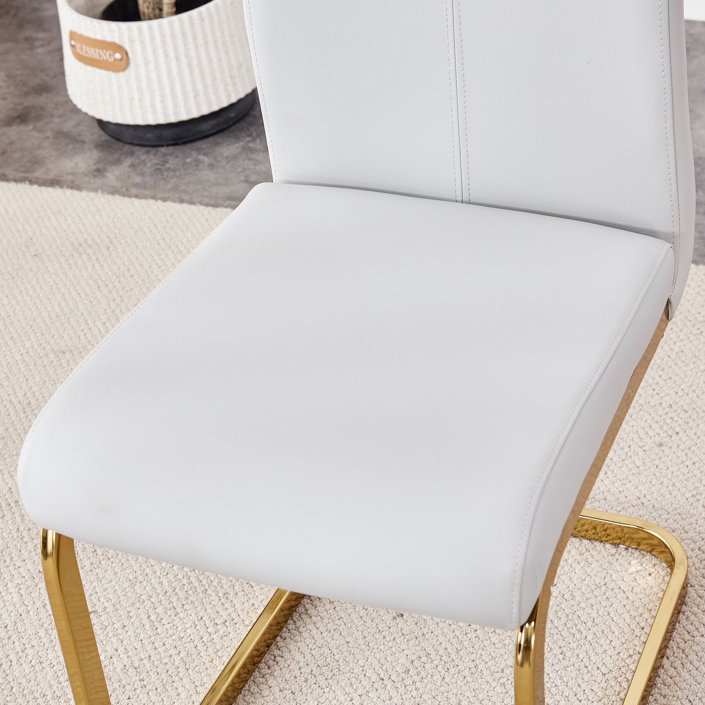Table and chair set.Large modern rectangular table with 0.4 inch patterned glass tabletop and large MDF table legs.Comes with 6 chairs with faux leather cushioned seats and golden metal legs.