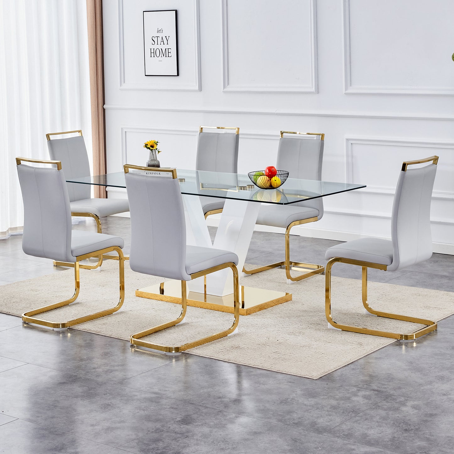 Table and chair set.Subtle Luxury Clear Tempered Glass Dining Set - 71"x35.4" with 6 Light Gray PU Chairs.C-tube Gold Metal Chair Legs.Bring a comfortable home experience to the kitchen, bedroom.