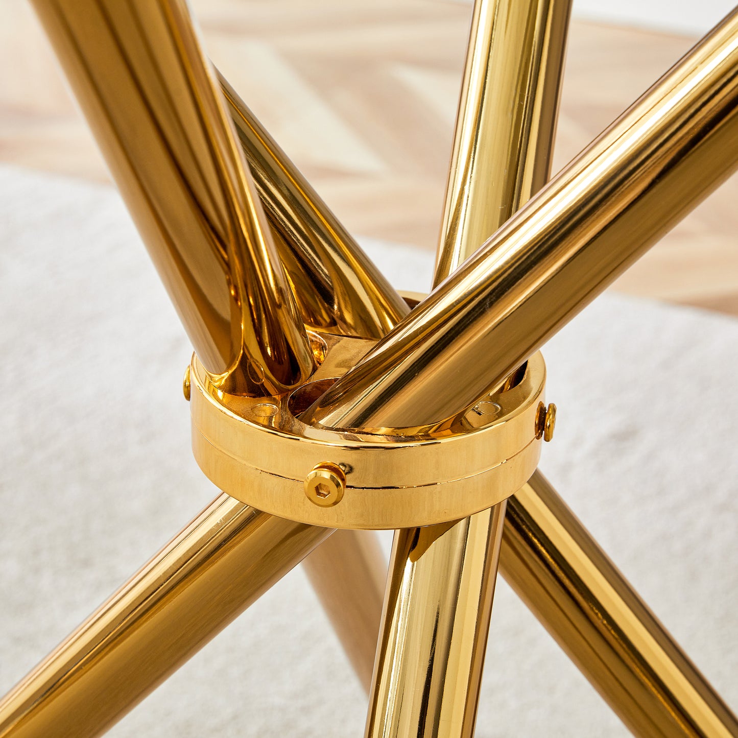 Round clear glass dining table with a unique shape for 4-6 people, with ring-shaped gathered gold metal legs, suitable for desks, kitchens, terraces, dining rooms.