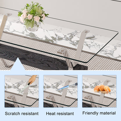 Table and chair set.Elegant Transparent Tempered Glass Dining Set - 71"x35.4" with 6 Black PU Chairs with a vertical stripe design on the backrest.
