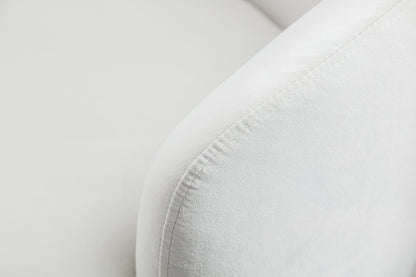 Sillón giratorio de terciopelo con acento tipo barril y aro metálico con recubrimiento en polvo negro, color blanco