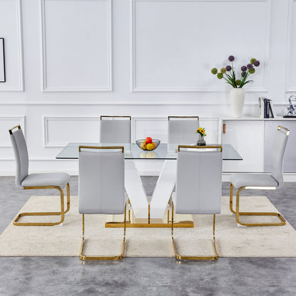 Table and chair set.Subtle Luxury Clear Tempered Glass Dining Set - 71"x35.4" with 6 Light Gray PU Chairs.C-tube Gold Metal Chair Legs.Bring a comfortable home experience to the kitchen, bedroom.