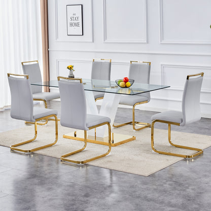 Table and chair set.Subtle Luxury Clear Tempered Glass Dining Set - 71"x35.4" with 6 Light Gray PU Chairs.C-tube Gold Metal Chair Legs.Bring a comfortable home experience to the kitchen, bedroom.